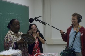 Lynette Bell (at far left) is recorded by "Marketplace" while telling the class about her thwarted ambitions to cook like a Food Network chef. Pictured with Anne Choi, assistant professor of interdisciplinary studies.