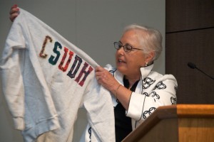 Nancy Carlson, who was awarded Alumni of the Year, proudly displays her "CSUDH" sweatshirt.
