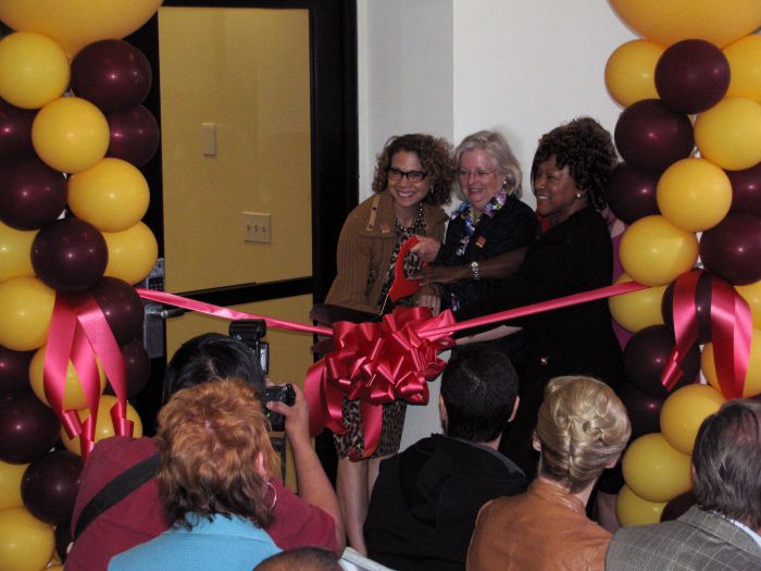 L-R: President Mildred García, Carole Shea, former director, SON; and Patricia Hinchberger, Patricia Hinchberger, lecturer and director of the MEPN Program, cut the ribbon on the new state-of-the-art nursing skills lab