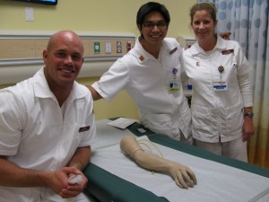 Students from the Master's Entry Level Professional Nurse (MEPN) program get a helping "hand" with the first-ever clinical skills lab on the CSU Dominguez Hills campus. L-R: Scott Deragisich, Joseph de Veyra, and Poppy Purcell