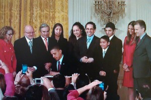 President Mildred García (at far left), looks on as President Barack Obama signs an executive order renewing and revising the White House Initiative on Educational Excellence for Hispanic Americans; courtesy of whitehouse.gov