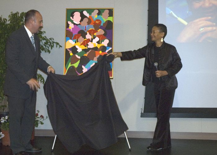 Artist Synthia SAINT JAMES and Toby Bushee, manager, Ceremonies and Events, unveil "Cincuenta," which commemorates CSU Dominguez Hills' 50th anniversary