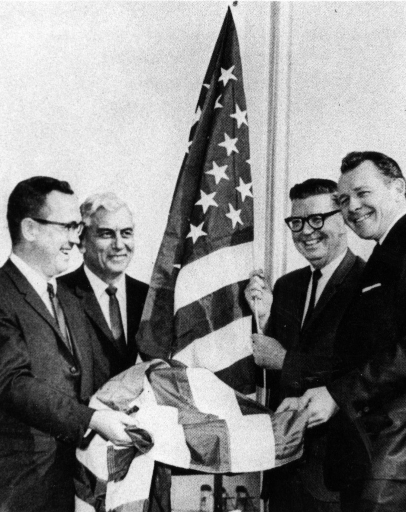 As chairman of Watson Land Company, William Huston raised the first flag on the campus of California State College, Dominguez Hills with CSC Chancellor Glenn Dumke, first CSC Dominguez Hills president Leo Cain, and Lt. Governor Robert Finch. Courtesy of Tom Philo, University Archives