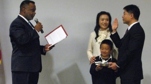 Sen. Ted Lieu was sworn in by Jerome Horton, chair of the California State Board of Equalization, and with the assistance of his wife, Betty Lieu and son Brennan.