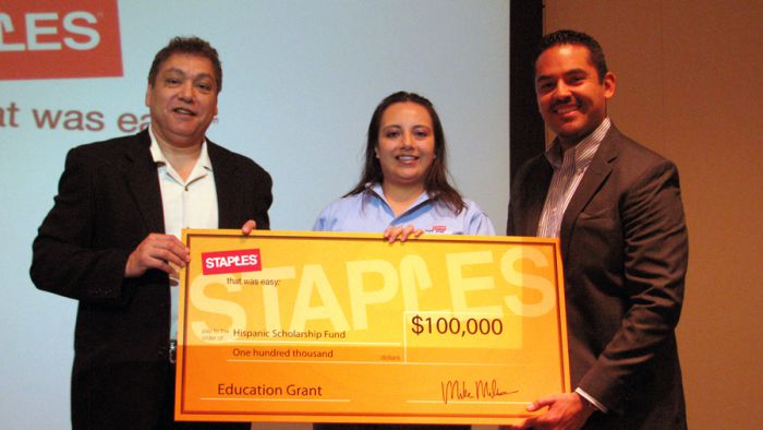 Eloy Gaitan and Karla Zenteno of Staples Cerritos present a check to HSF regional program director Jose Gutierrez (right)