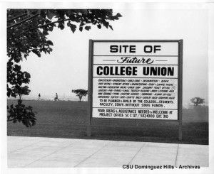Sign posted on campus at the location of future student union site. ca. 1986.