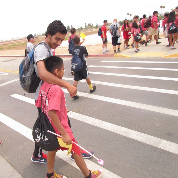 CSU Dominguez Hills senior and YDA counselor Gabriel Ramos connects with a student during the summer camp.