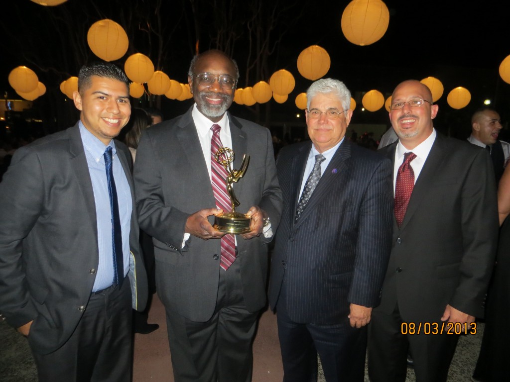 University President Willie J. Hagan holding the Governors Award Emmy. Also picture (l to r): David Gamboa, CSUDH director of government and community relations, Jorge Haynes, sr. director of CSU External Relations, and Toby Bushee, CSUDH director of events and donor stewardship