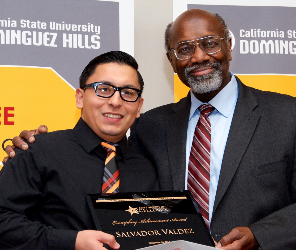University President Willie J. Hagan presents the 2013 Staff Exemplary Achievement Award to Salvador Valdez.