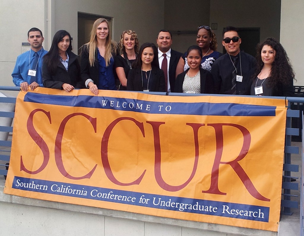 (From left) Jose Rodriguez, Kristen Berube, Spencer Nelson, Michelle Manning, Angela Lim, Jam Isaga, Alisha Fletcher, Casey Cho, Jasmine Wahab, and their faculty advisor Enrique Ortega (center, back row) attend the 2013 Southern California Conference for Undergraduate Research