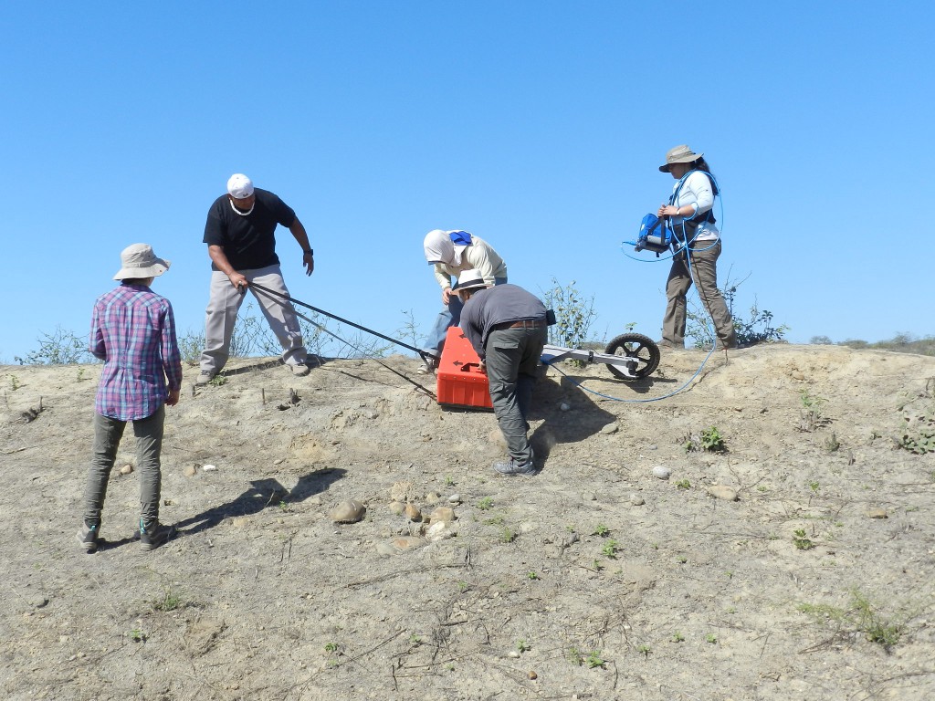 photo of students pulling a ground penetrating radar