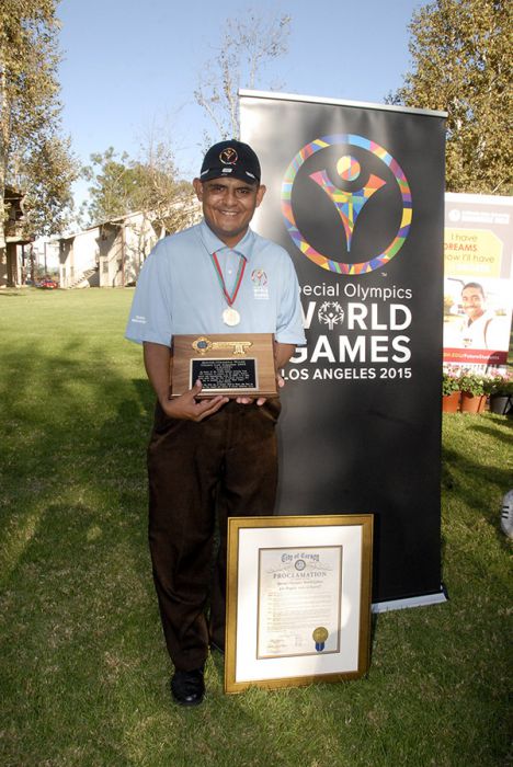 Special Olympics World Games Global Messenger Marco Martinez with the key to the city and proclamation from the City of Carson.