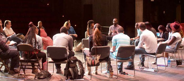 Theatre arts students form collaborative circle during McCraney visit.