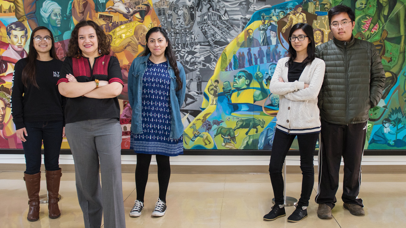  Ximena Cid, assistant professor of physics, and her students. 