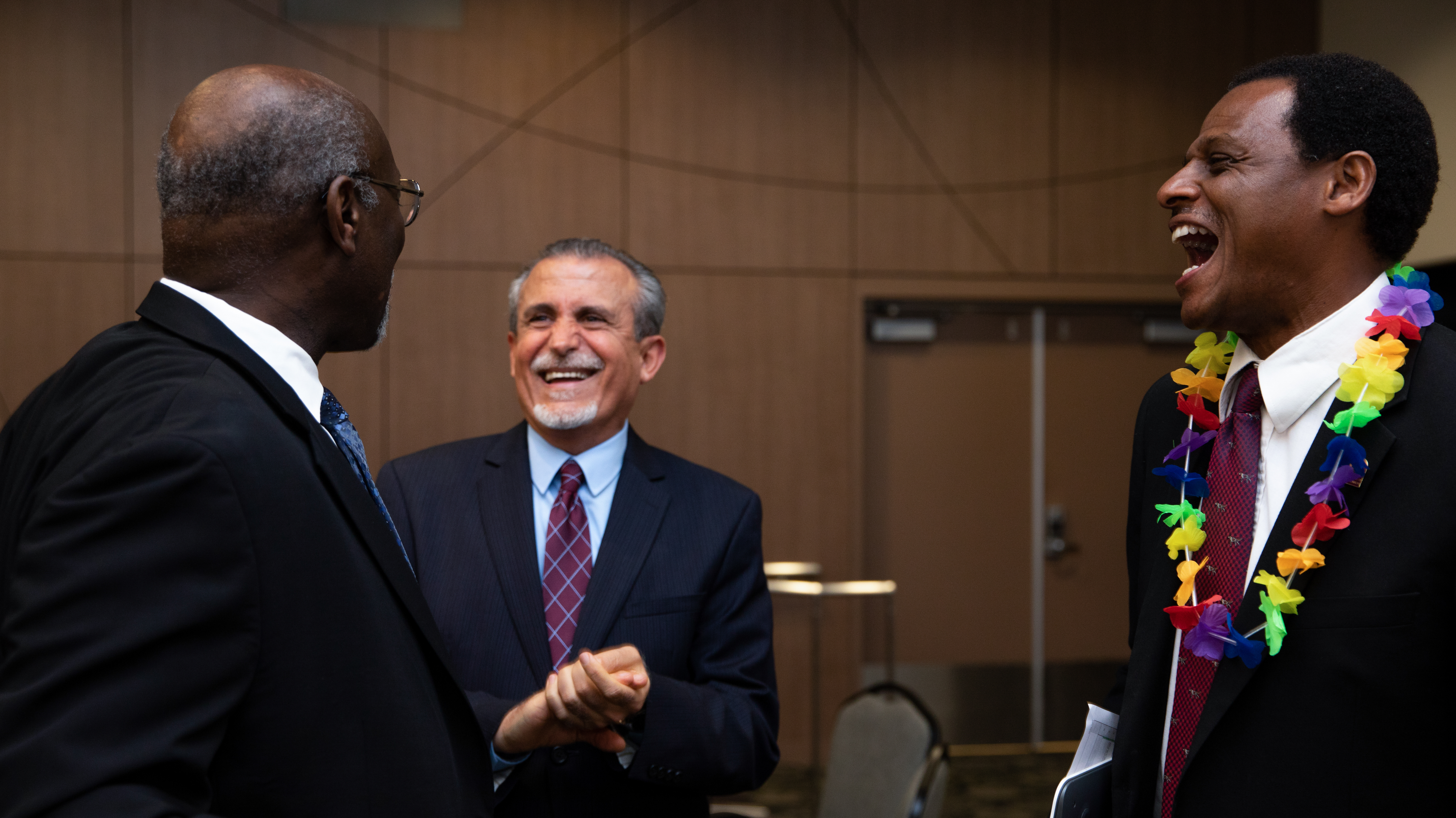 Preidenet Willie J. Hagan has a laugh with Kamal Hamden, an Annenberg endowed professor and director of the Center for Innovation in STEM Education; and John Davis, dean of the College of Education.