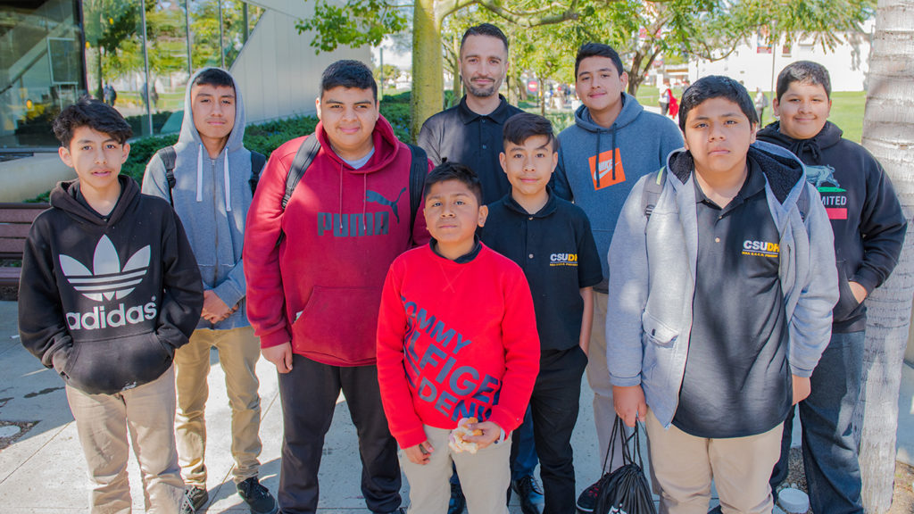 Oscar Perez, an academic counselor at LA Academy Middle School, with his school's MSA mentees.