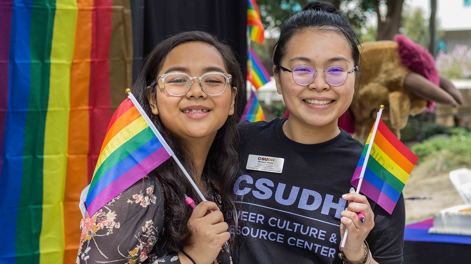 Students celebrate at the grand opening of the Queer and Cultural Resource Center.