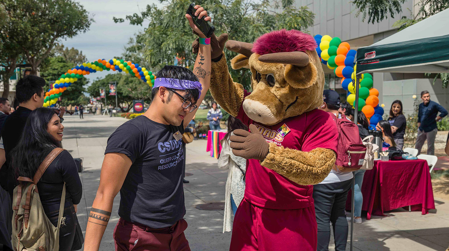 Teddy the Toro joins the celebration at the Queer Culture and Resource Center