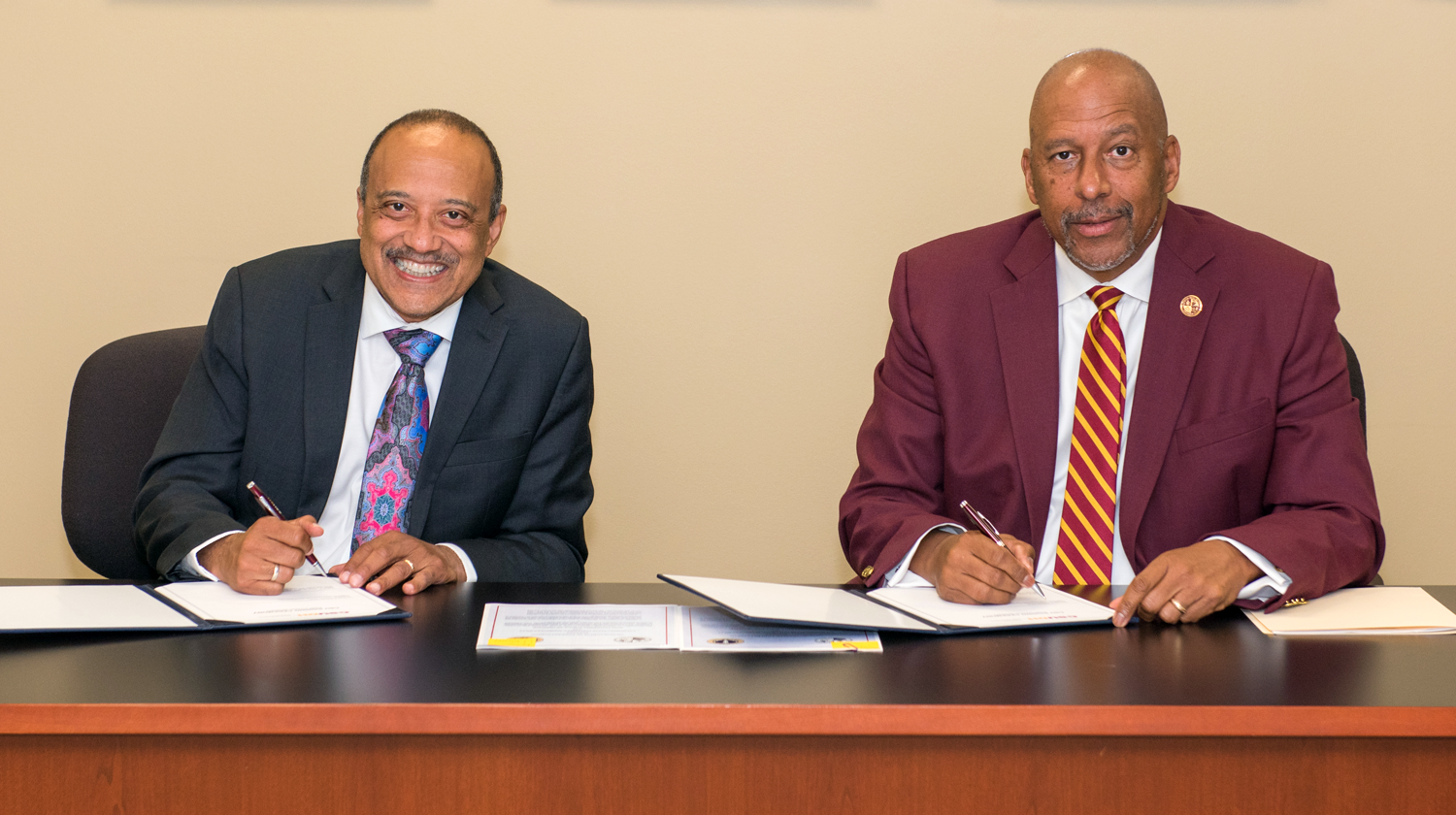 Left to Right: William F. Owen, dean and chancellor of RUSM, and Thomas A. Parham, president of CSUDH.