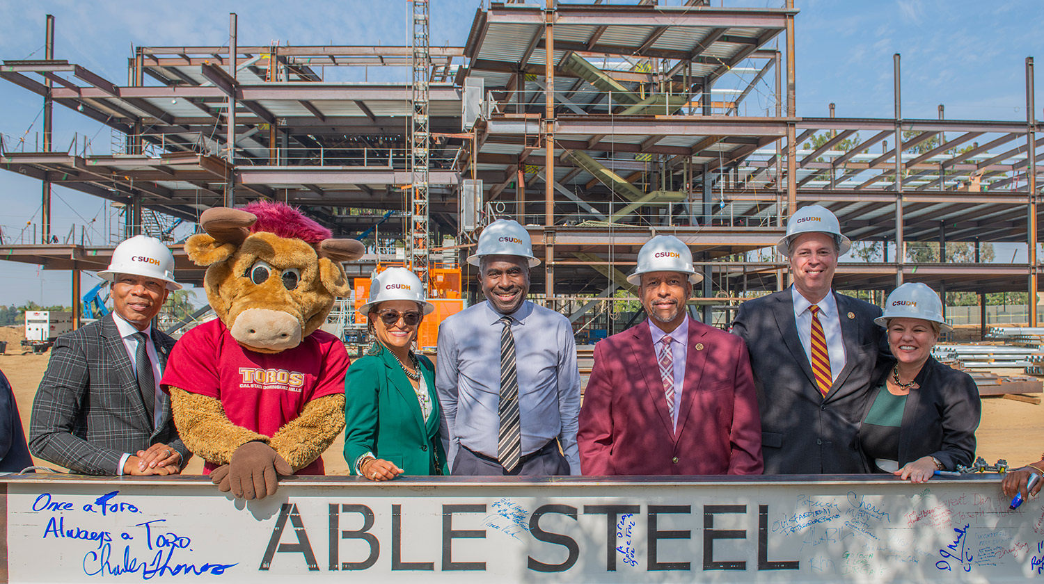 (Left to Right): VP for Student Affairs William Franklin, Teddy the Toro, president's Chief of Staff Deborah Roberson-Simms,Interim VP of Administration and Finance Ron Coley, CSUDH President Thomas A. Parham, VP for Student Affairs Michael Spagna, and VP for University Advancement Carrie Stewart. 