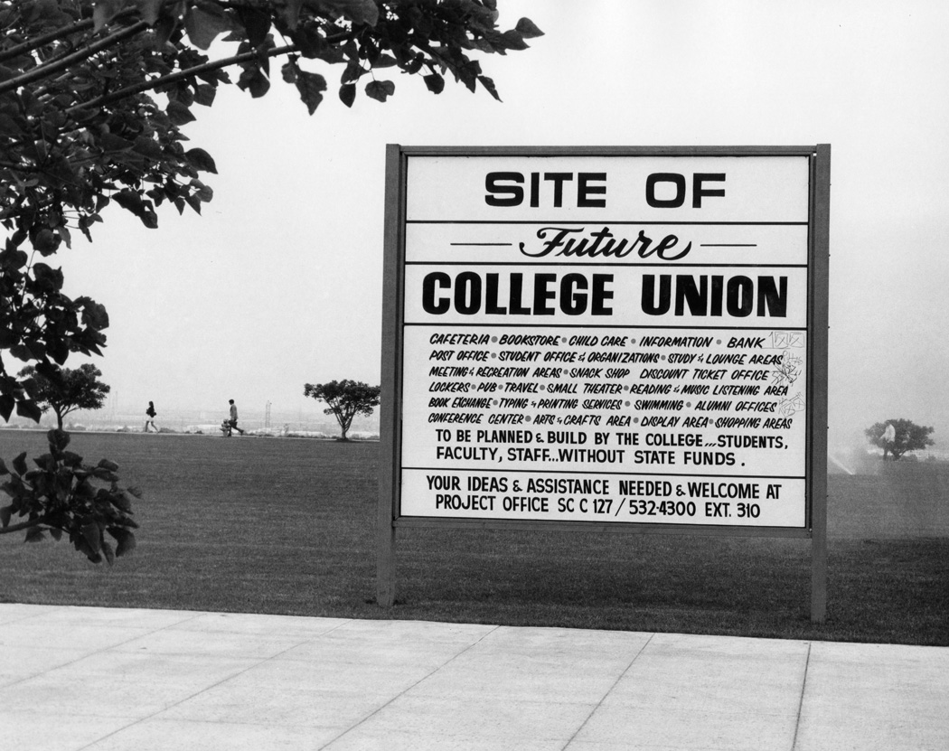 Sign posted on campus at location of future student union site, ca. 1986