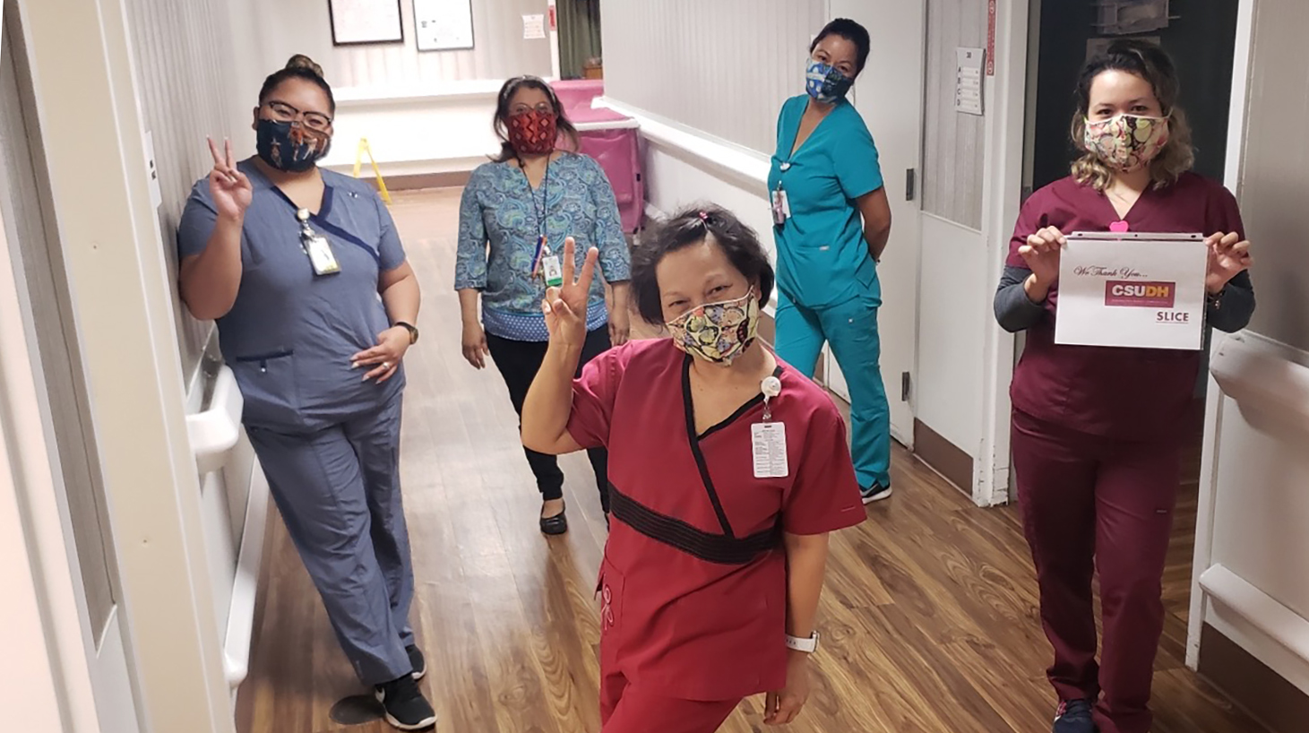 Health care professionals at Rosecrans Care Center in Gardena wear face masks donated by SLICE.
