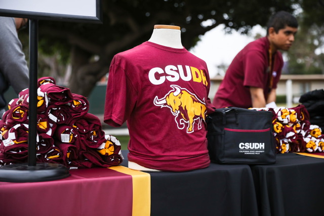 table with CSUDH Tshirt display