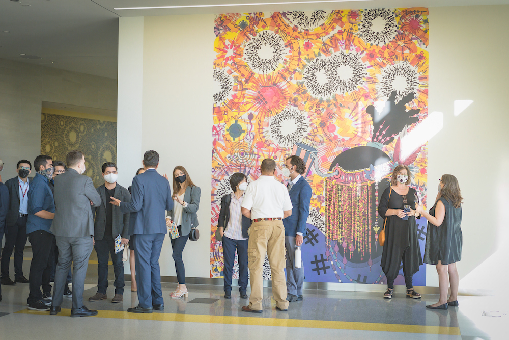 Visitors explore the colorful interior of the Innovation and Instruction Building.