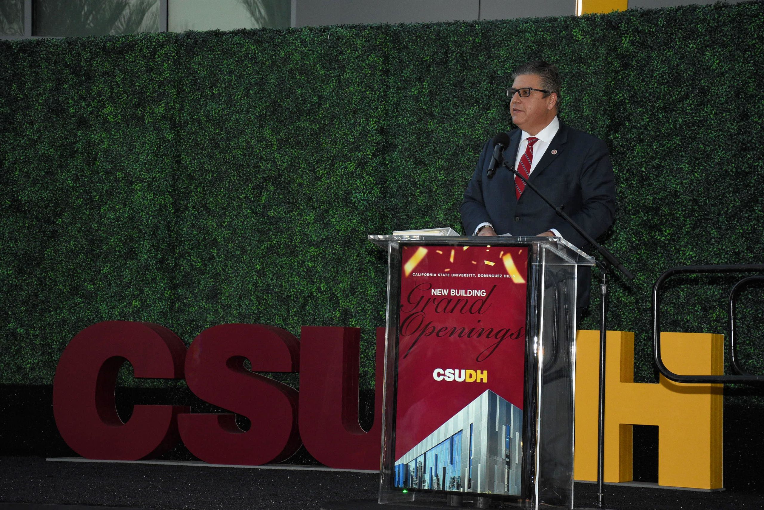 CSU Chancellor Joseph I. Castro addresses attendees outside the CSUDH Innovation and Instruction Building.