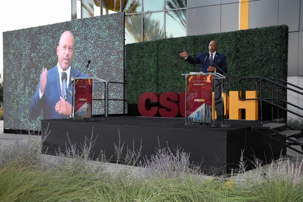CSUDH President Thomas A. Parham addresses the crowd gathered outside the Innovation and Instruction Building.