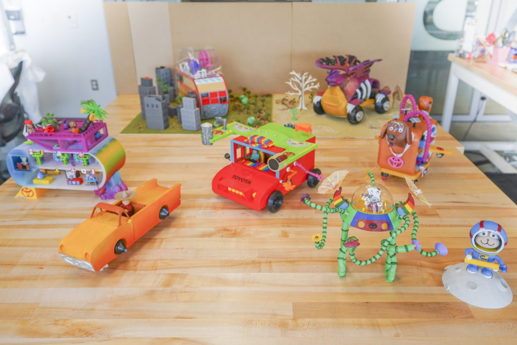 Seven 3D printed model of cars designed by children for the Toyota Dream Car contest.