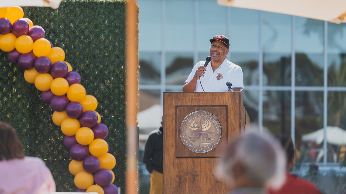 President Thomas Parham at a podium to provide welcome remarks at Homecoming.
