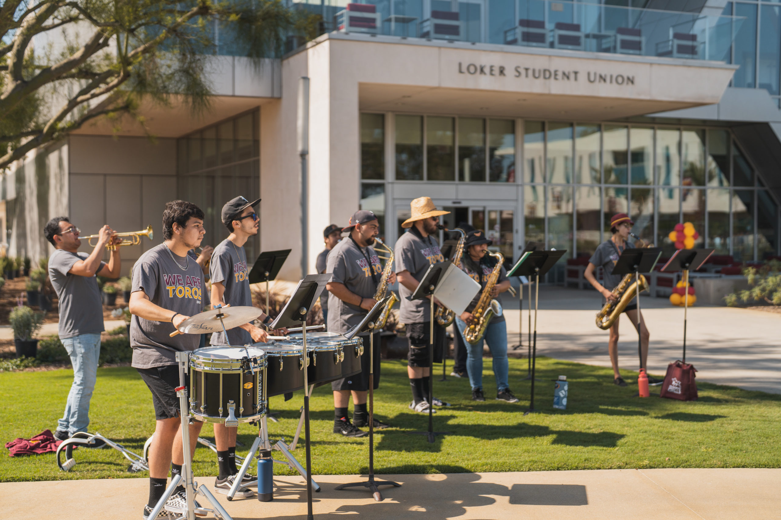The Toro Pep Band and Drumline perform outside the Loker Student Union.