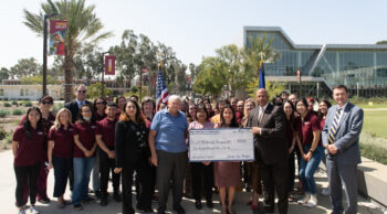 BarragÃ¡n (center) with CSUDH faculty, students, and administrators.