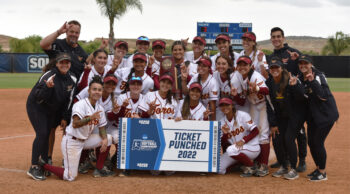 Cal State Dominguez Hills softball team pose on the field after winning the western regionals