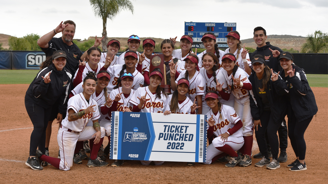 Cal State Dominguez Hills softball team pose on the field after winning the western regionals