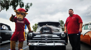 Teddy the Toro and student from Scholars United with low rider car