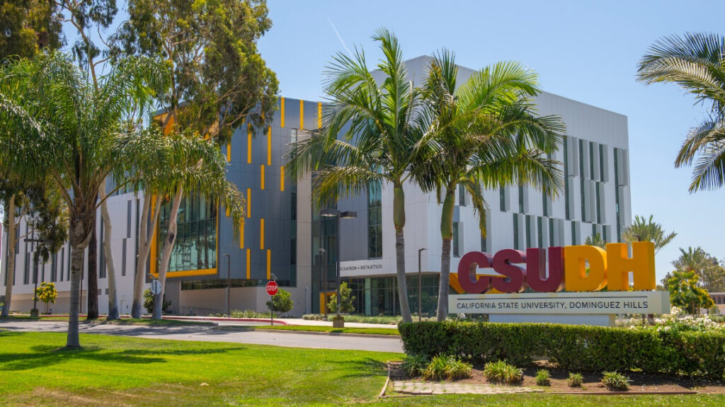 CSUDH sign on Victoria, Innovation and Instruction building in background