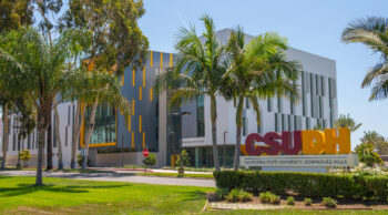 CSUDH sign on Victoria, Innovation and Instruction building in background