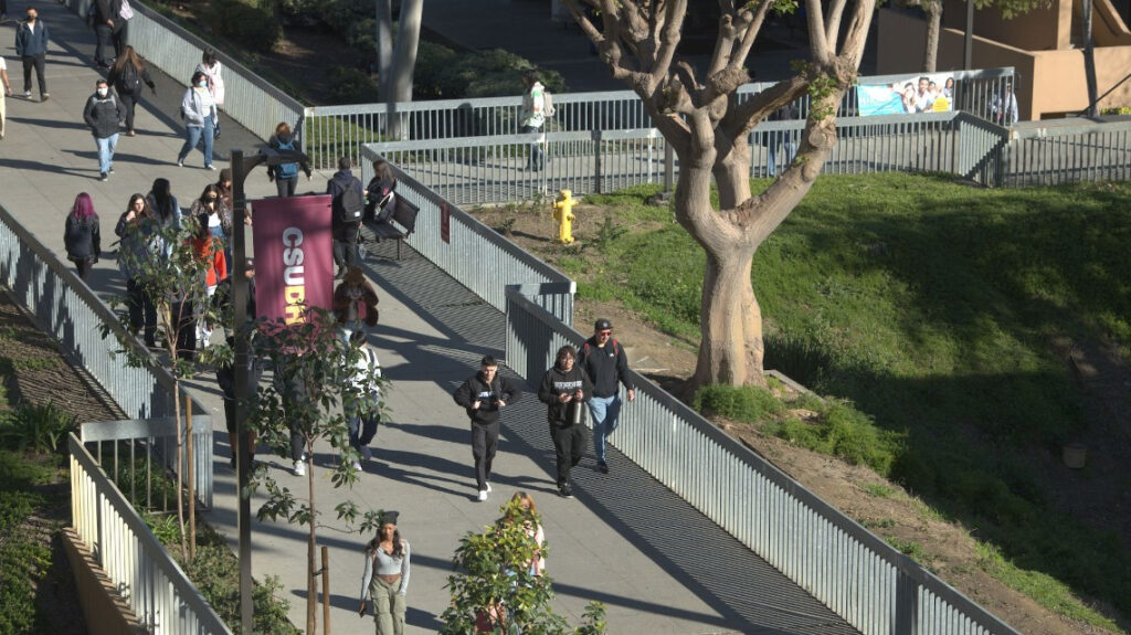 Students walking on a pathway on the CSUDH campus