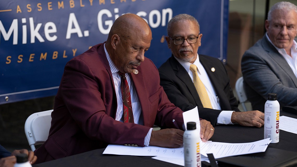 CSUDH President Thomas A. Parham signs the Compton Health Professions Partnership during an event at Leo F. Cain Library.
