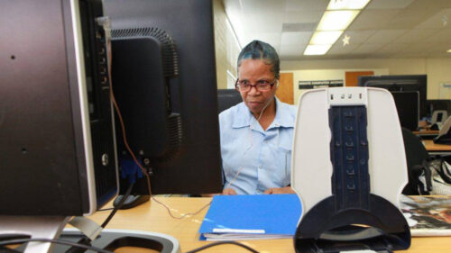 Woman doing work on a computer.
