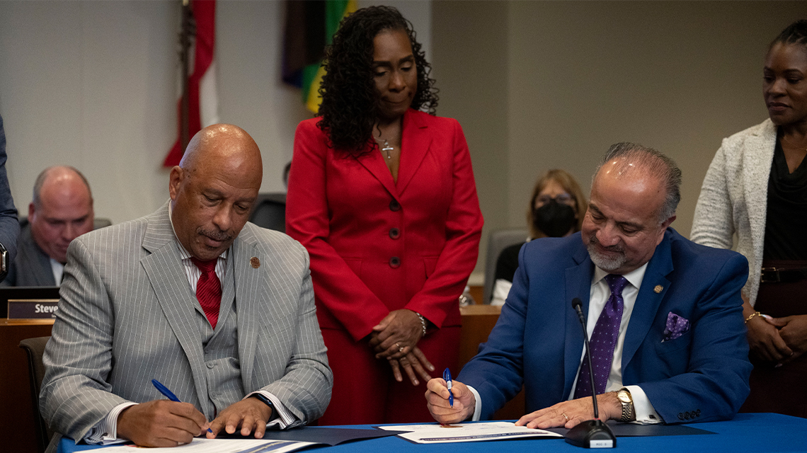 CSUDH President Thomas A. Parham and LACCD Chancellor Francisco C. Rodgriguez sign a new partnership aimed at improving student success.