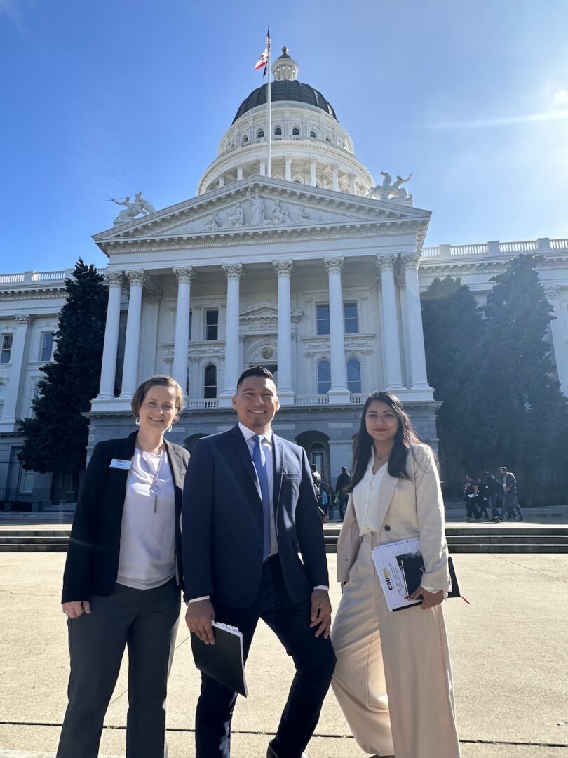 Eva Sevcikova, Edgar Mejia-Alezano, and Adilene Tinoco in front of the CA State Capitol