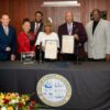 Mayor of Carson Lula Davis-Holmes and CSUDH President Thomas A. Parham with members of Carson City Council