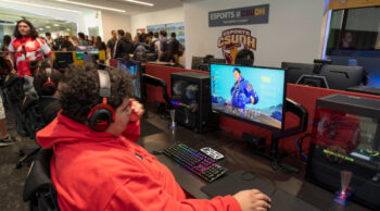 People playing games in the CSUDH esports facility