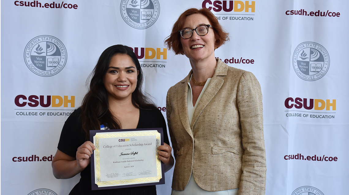 Jasmine Saffell, left, with Jessica Pandya, dean of the College of Education.