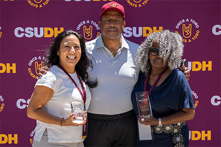 Dr. Parham poses with this year's Toro Alumni Award winners.