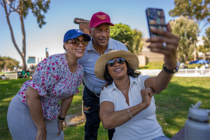 President Parham poses for selfies with alums at Homecoming 2024.