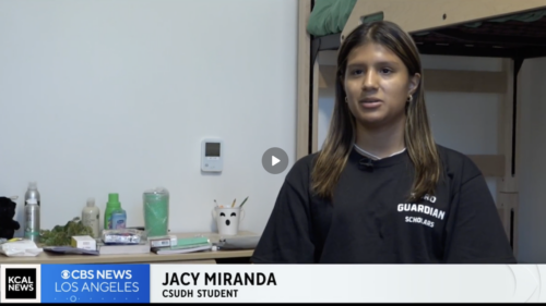 Student in dorm room. Chyron reads KCAL CBS News, Jacy Miranda, CSUDH Student